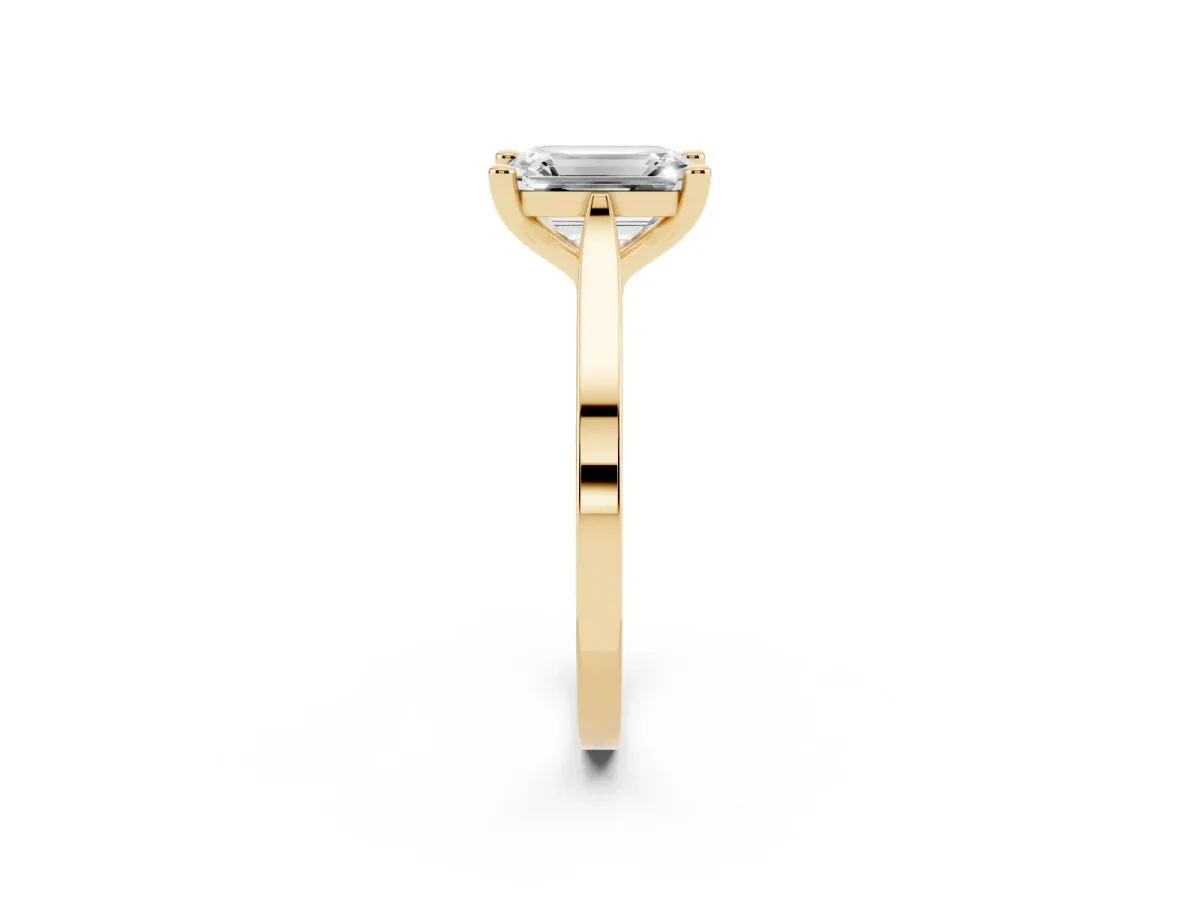 Emerald Cut Solitaire Diamond Ring with Four-Prong Setting and Tapered Band Yellow gold
