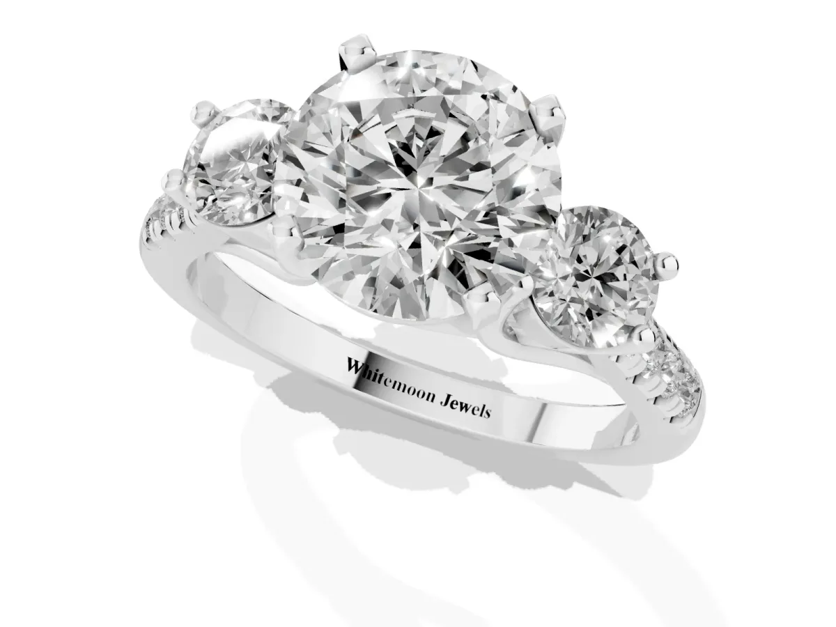 Three-Stone Round Cut Diamond Pavé Band with Four-Prong Setting Platinum