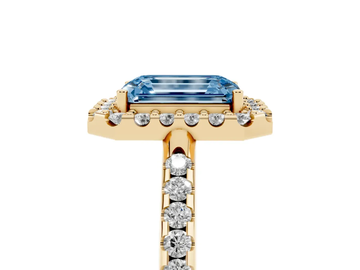 Fancy Blue Emerald Cut Diamond Pavé Halo Ring with Four-Prong Setting Yellow gold