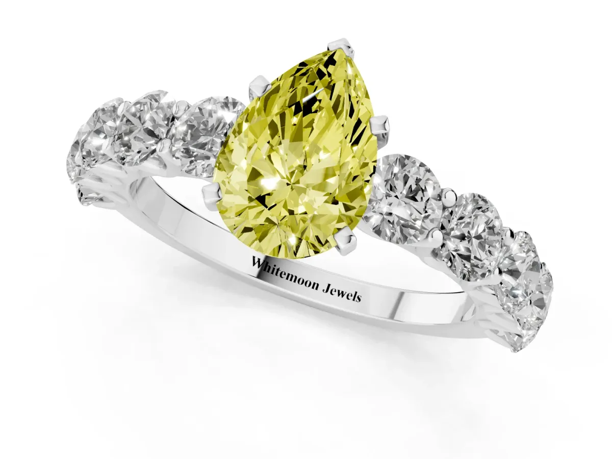 Fancy Yellow Pear Cut Diamond Prong Setting with Side Stones on a Pave Band Silver
