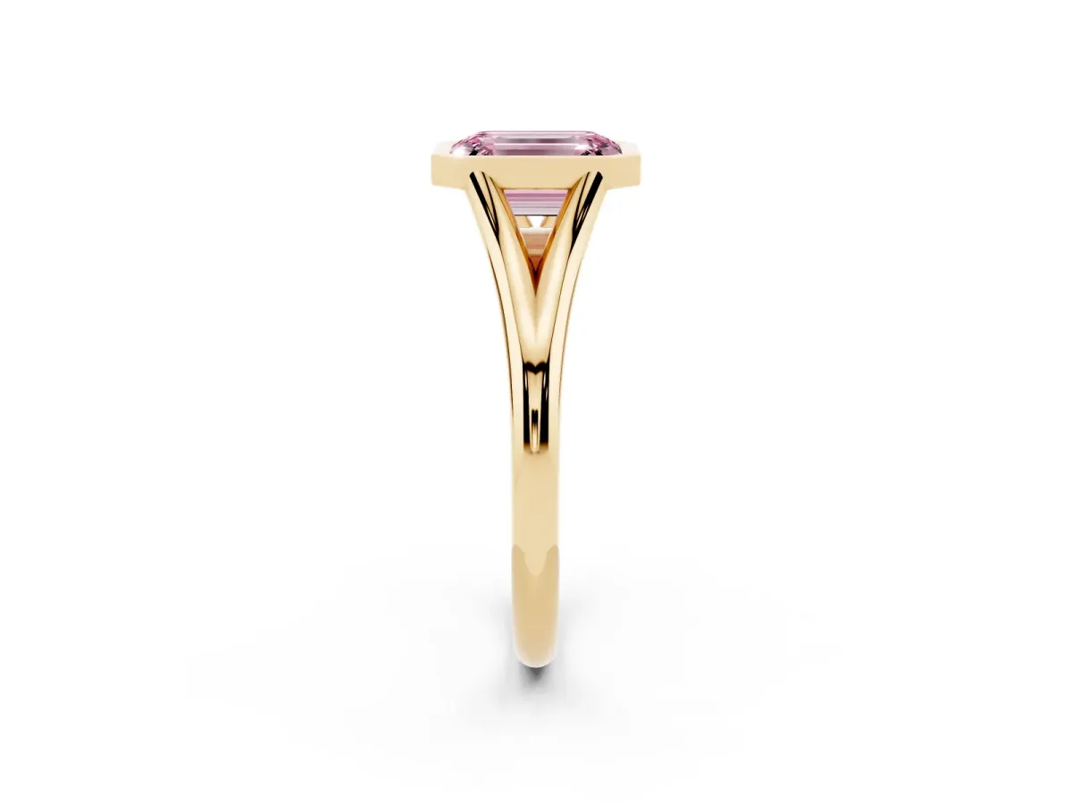 Fancy Pink Bezel Set Emerald Cut Cut Solitaire Ring with Tapered Band Yellow gold