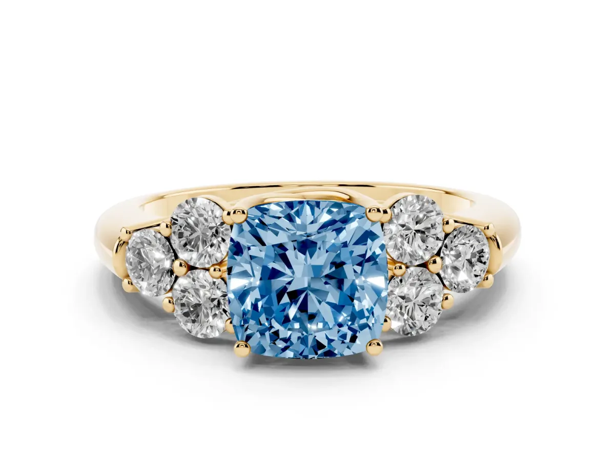 Fancy Blue Cushion Cut Cut Diamond Cluster Ring with Round Accent Stones and Prong Setting on a Classic Band Yellow gold