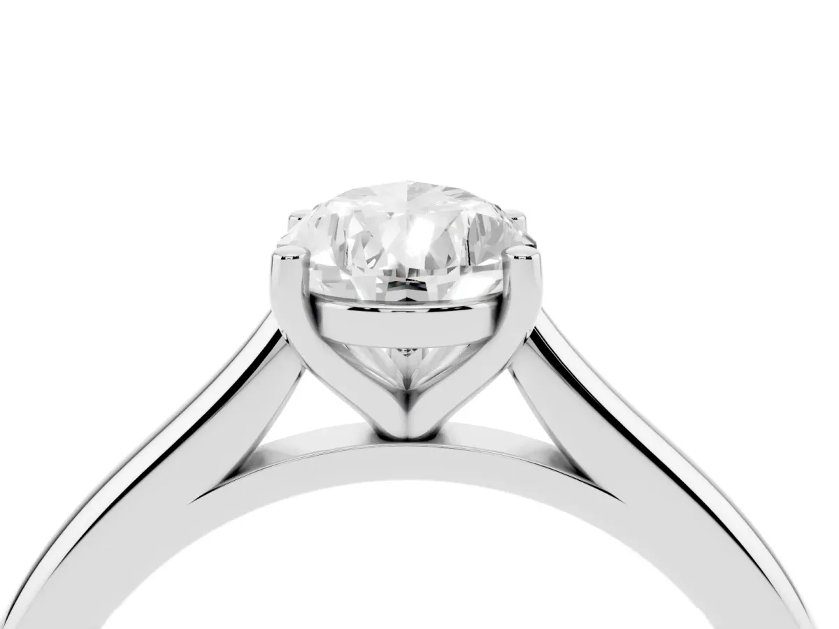 Pear Cut Cut Solitaire Ring with Cathedral Band and Four-Prong Setting Silver