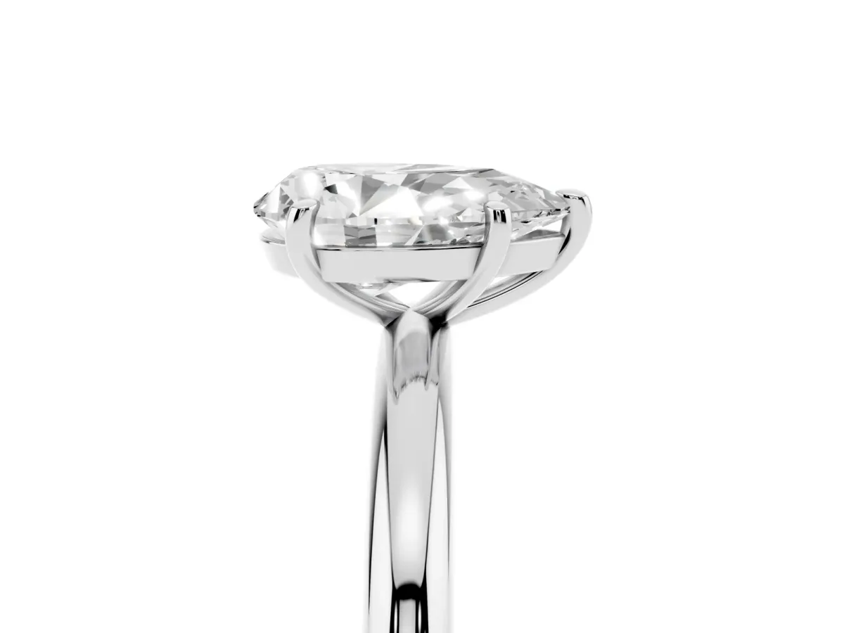 Pear Cut Solitaire Diamond Ring with Four-Prong Setting on a Plain Band Silver