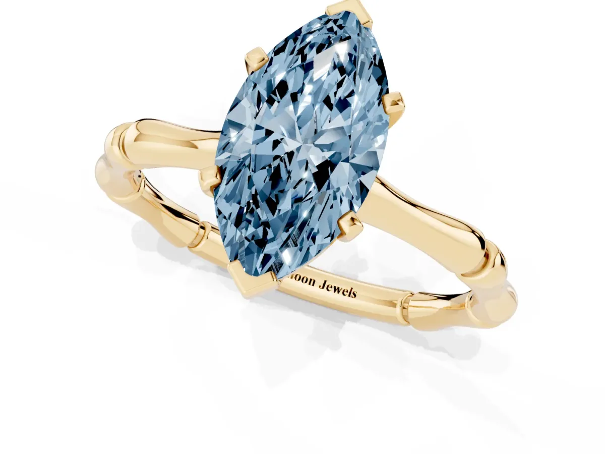 Fancy Blue Marquise Cut Solitaire Diamond Ring with Bamboo Band and Four-Prong Setting Yellow gold