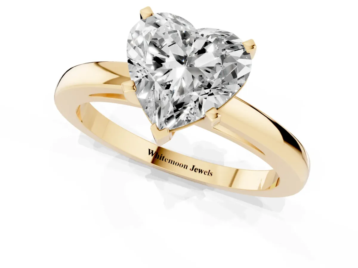Heart Cut Solitaire Diamond Engagement Ring with Four-Prong Setting on a Classic Band Yellow gold