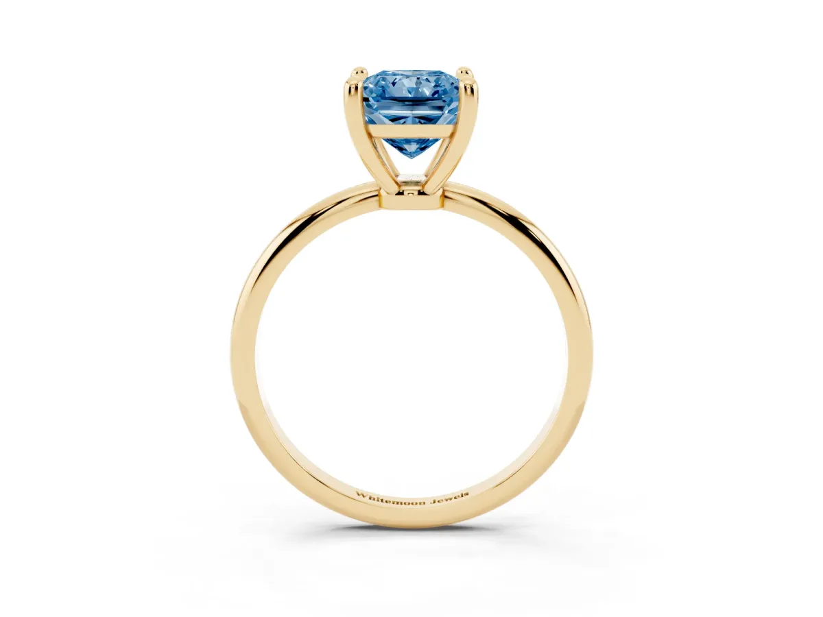 Fancy Blue Radiant Cut Solitaire Diamond Ring with 4-Prong Setting on a Classic Band Yellow gold