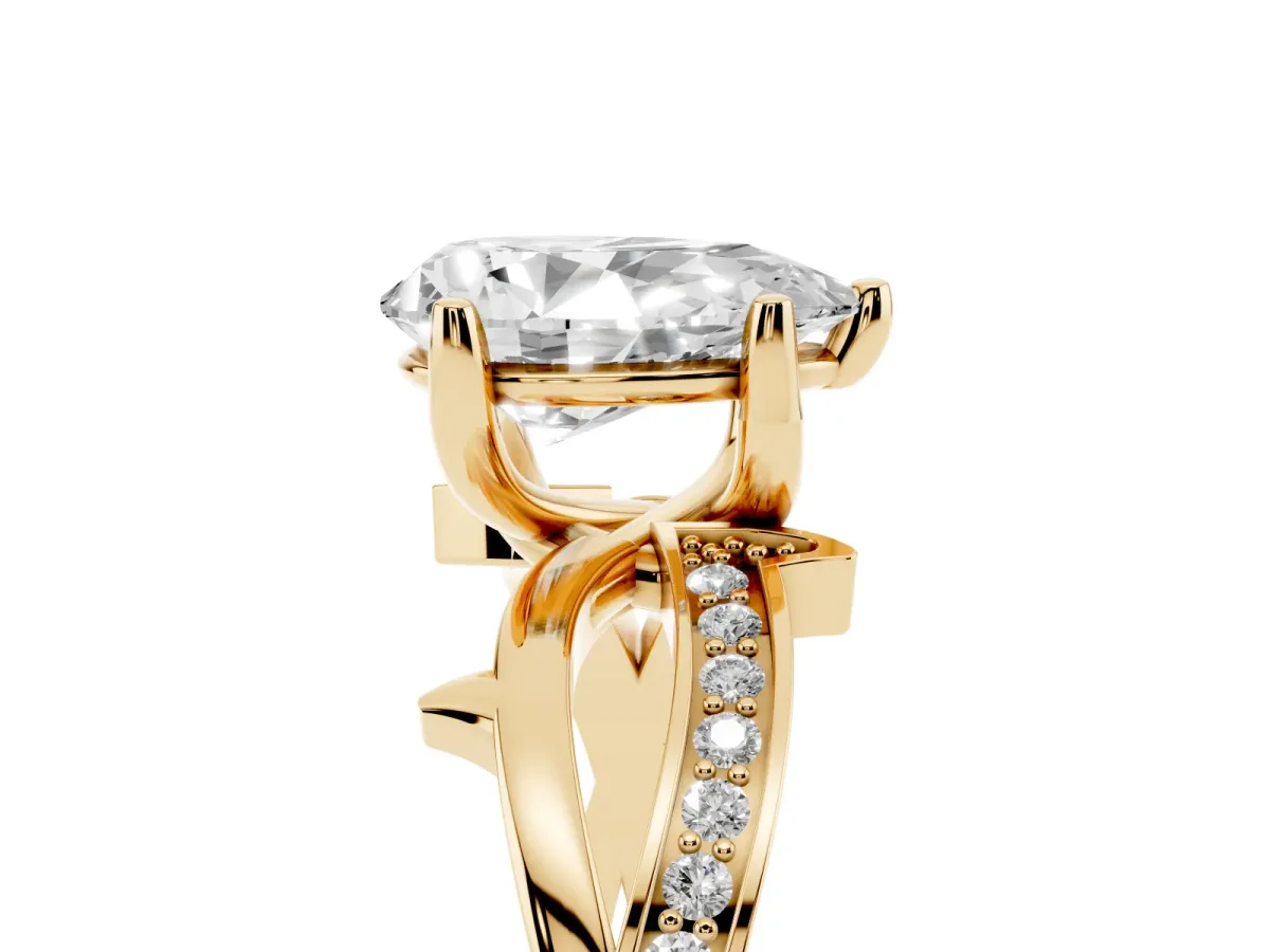 Pear Cut Solitaire Twist Band with Pavé Accents and Four-Prong Setting Yellow gold