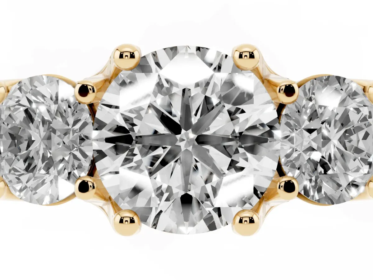 Round Cut Diamond Three-Stone Ring with Channel Set Band and Four-Prong Setting Yellow gold
