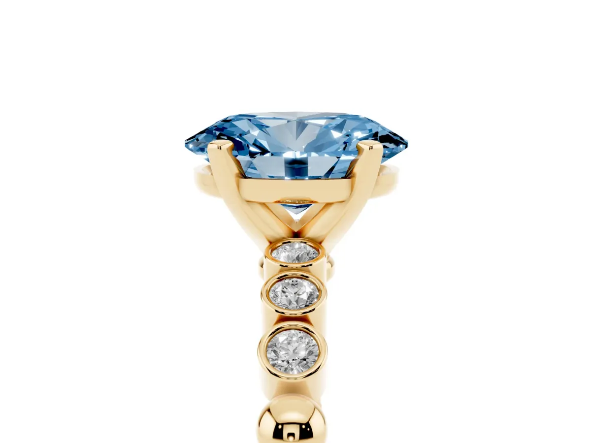 Fancy Blue Oval Cut Solitaire Bezel Accent Diamond Engagement Ring with Beaded Band and Four-Prong Setting Yellow gold