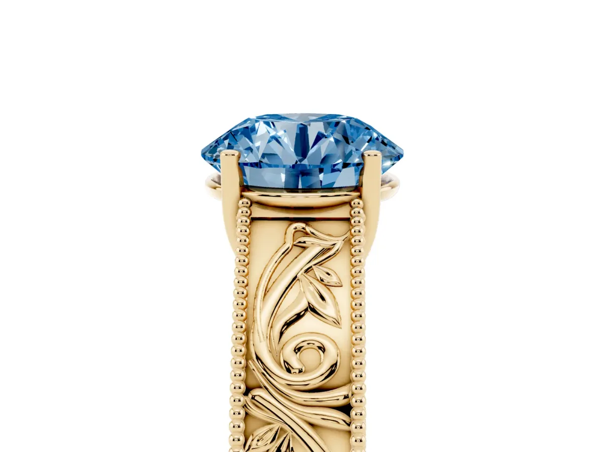 Fancy Blue Round Cut Diamond Solitaire Ring with Engraved Band and Four-Prong Setting Yellow gold