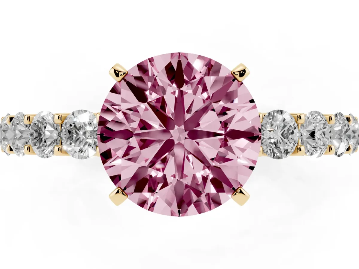Fancy Pink Round Cut Diamond Solitaire Ring with Shared Prong Pavé Band and Four-Prong Setting Yellow gold