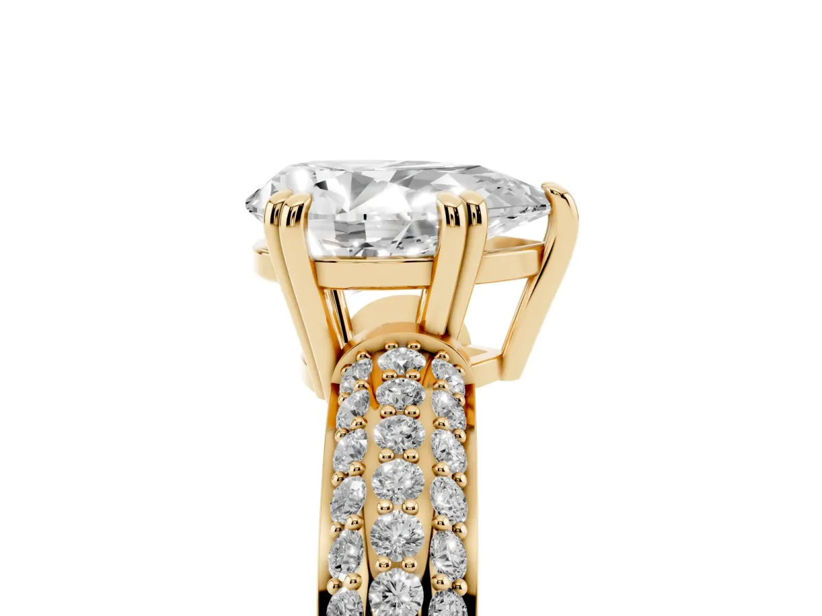 Pear Cut Diamond Solitaire Ring with Multi-Row Round Pavé Band and Prong Setting Yellow gold
