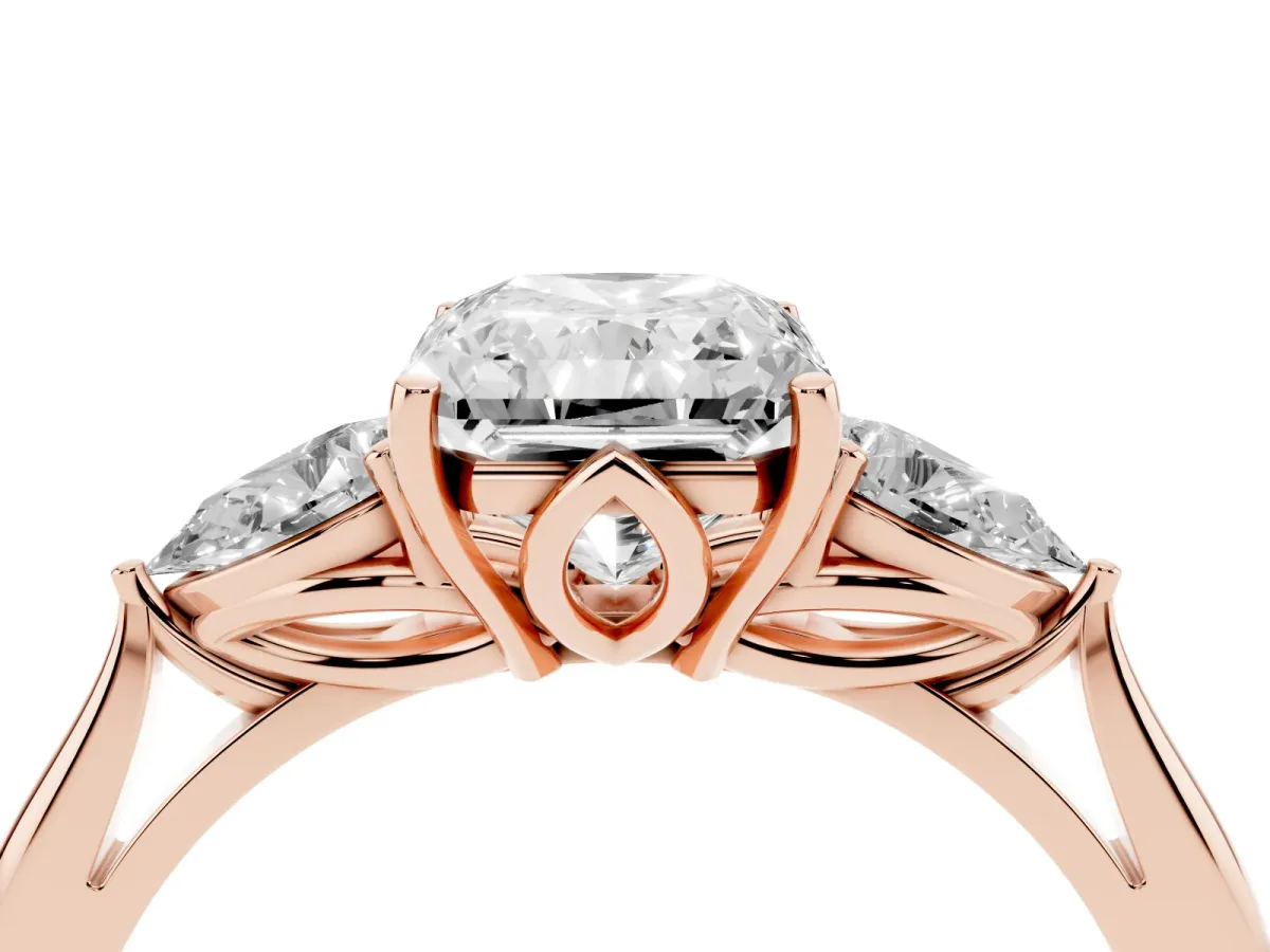 Three-Stone Radiant Cut Diamond Ring with Pear Side Stones in Four-Prong Setting Rose gold