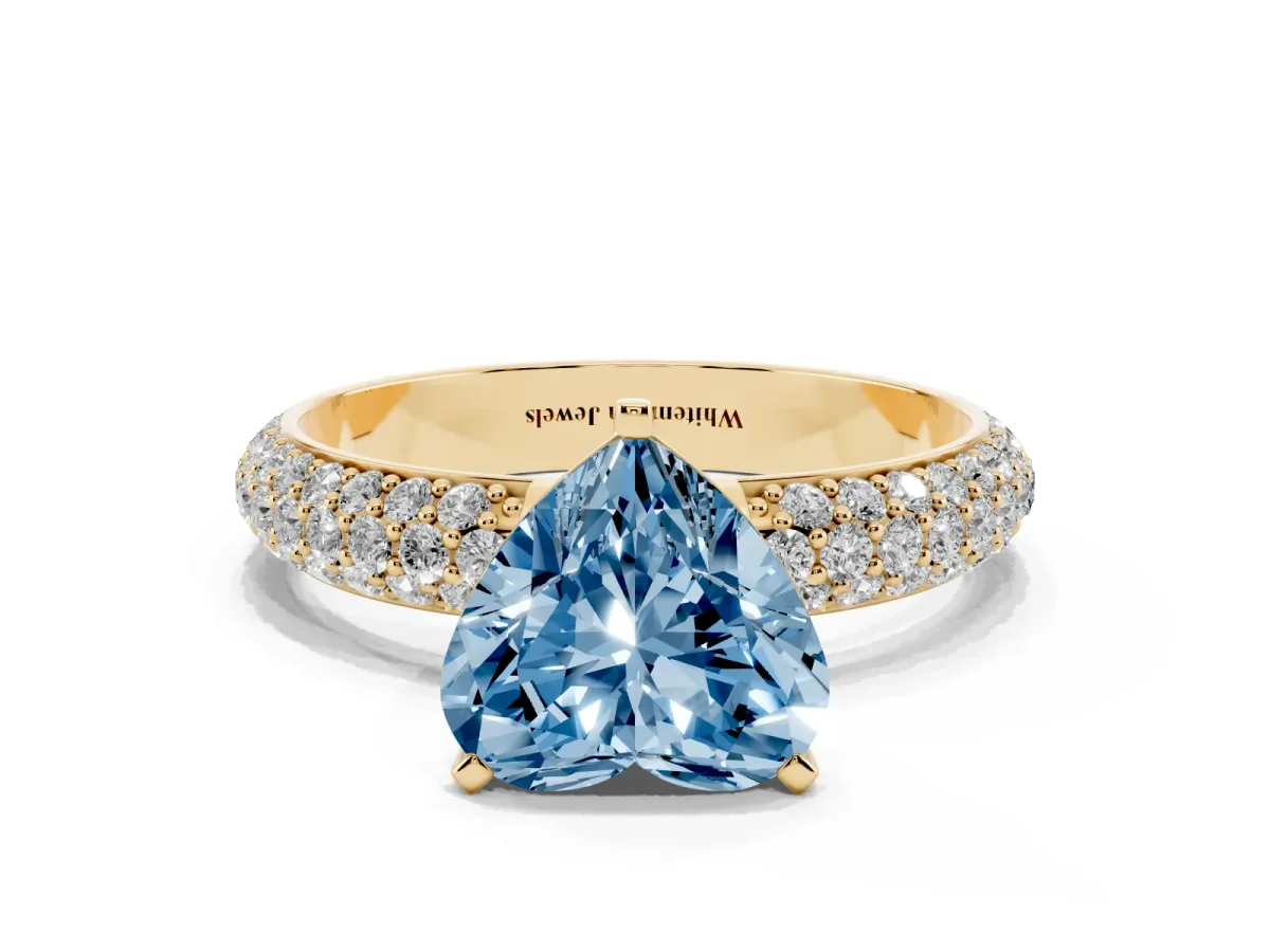 Fancy Blue Heart Cut Diamond Solitaire Ring with Prong Setting and Pavé Band Yellow gold