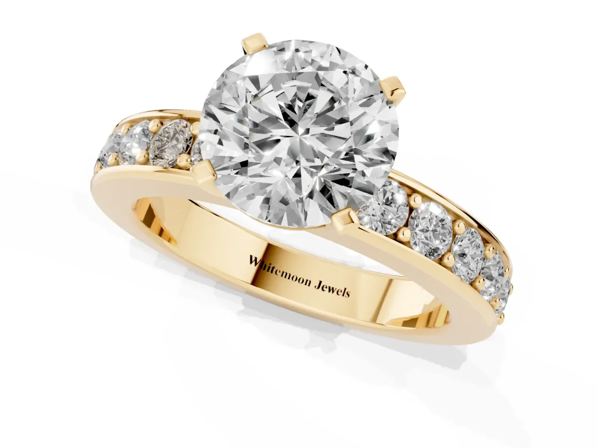 Round Cut Diamond Engagement Ring with Channel Set Round Band and Prong Setting Yellow gold