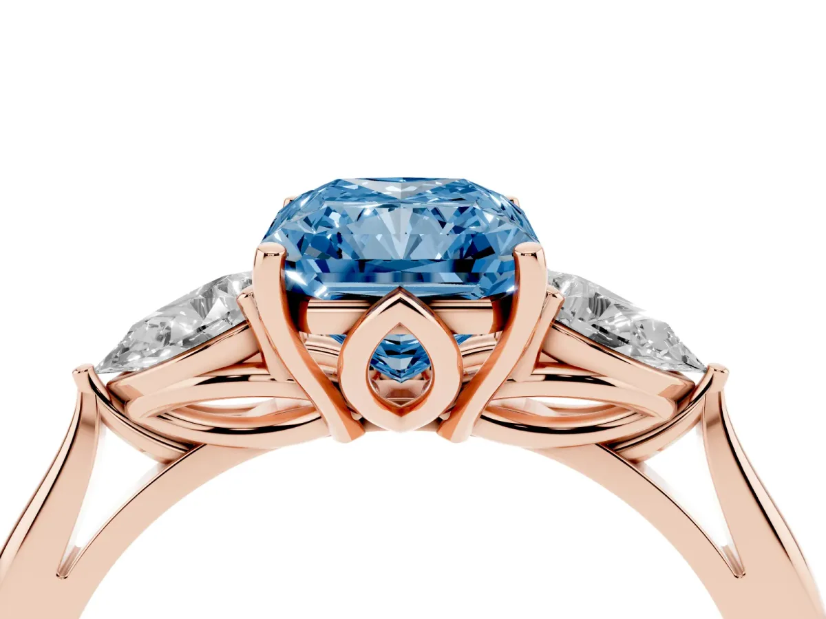 Fancy Blue Three-Stone Radiant Cut Diamond Ring with Pear Side Stones in Four-Prong Setting Rose gold