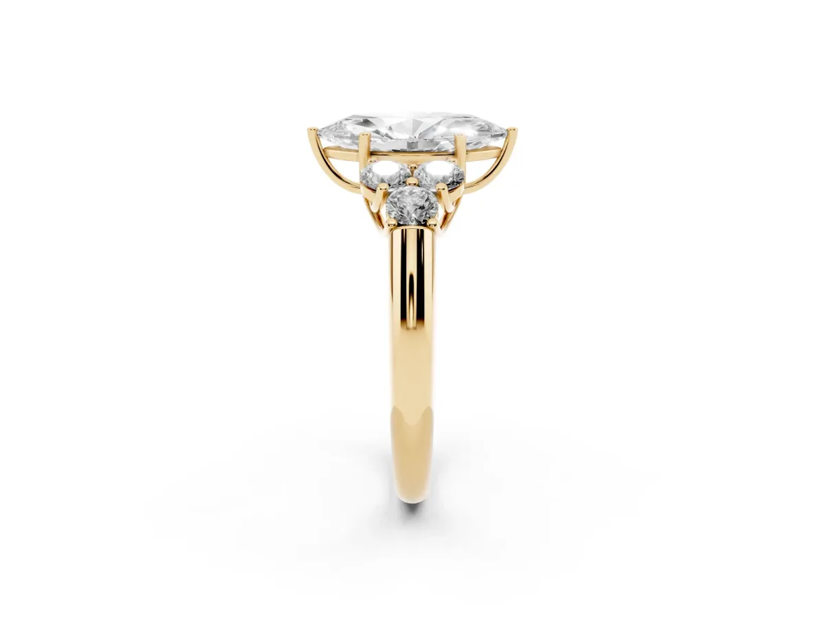 Marquise Cut Cut Diamond Cluster Ring with Round Accent Stones and Prong Setting on a Classic Band Yellow gold