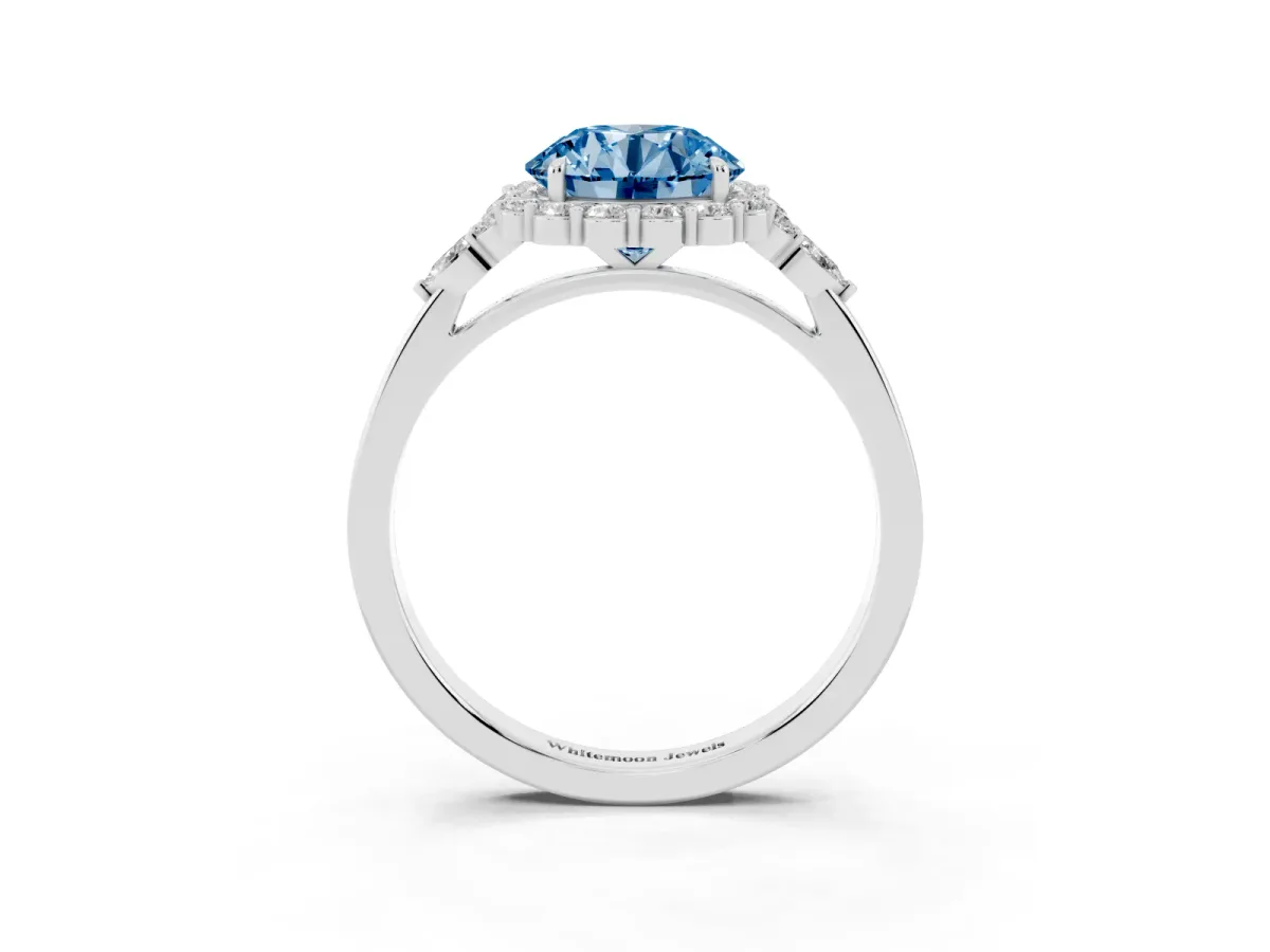 Fancy Blue Round Cut Diamond Halo Ring with Pear Side Stones and Prong Setting Silver