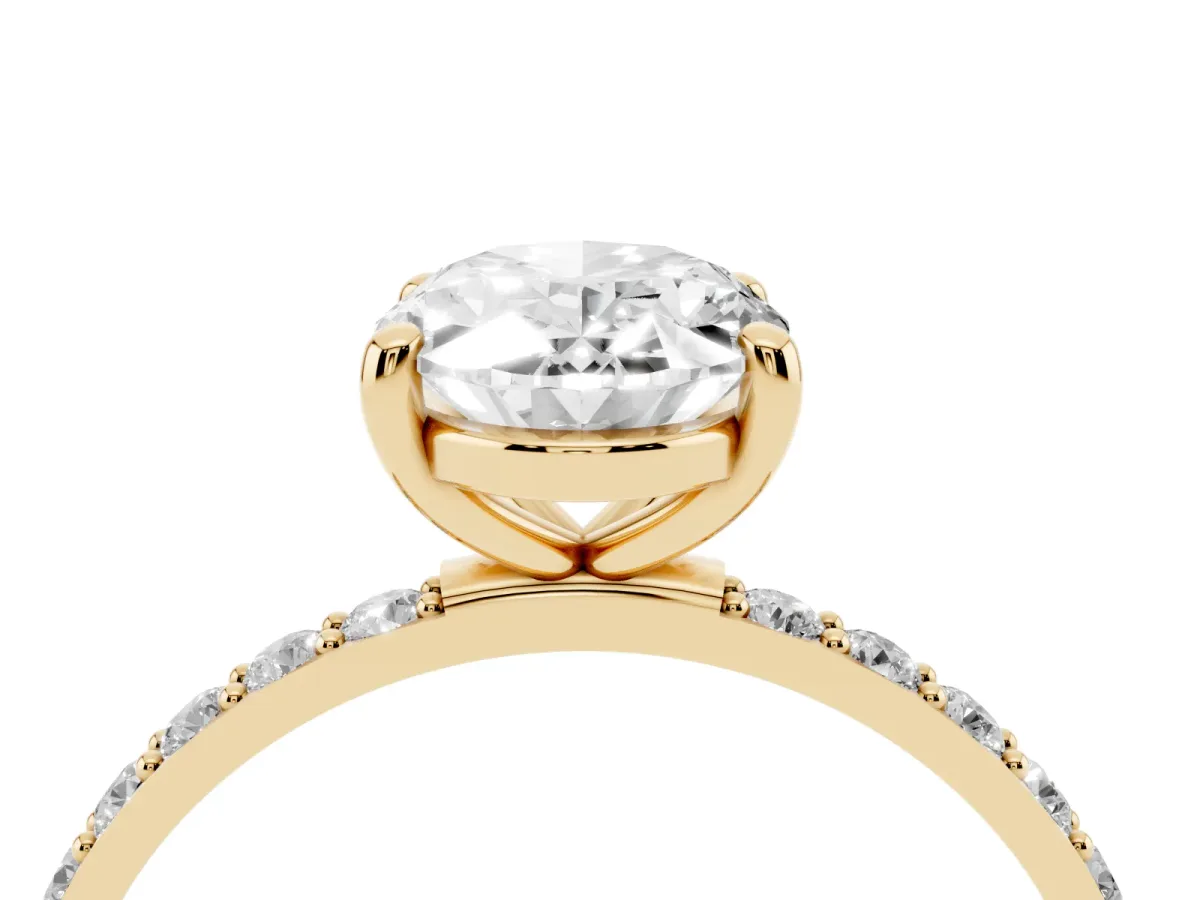 Oval Cut Diamond Solitaire Ring with Round Pavé Band and Prong Setting Yellow gold