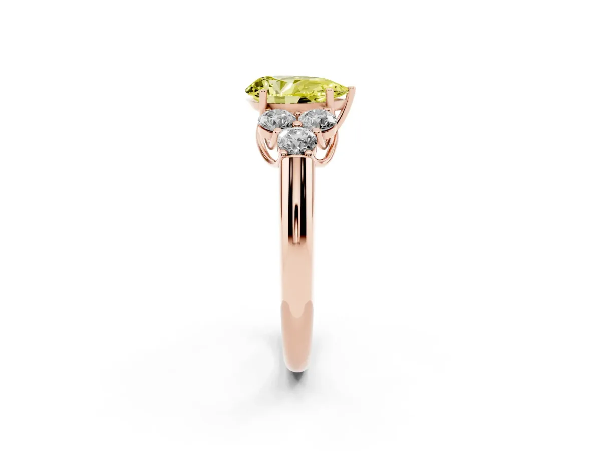 Fancy Yellow Pear Cut Cut Diamond Cluster Ring with Round Accent Stones and Prong Setting on a Classic Band Rose gold