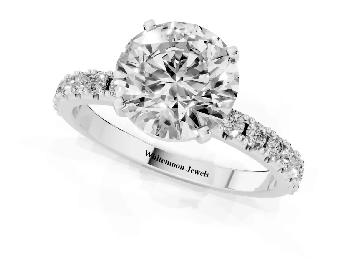 Round Cut Diamond Solitaire Pavé Band with Four-Prong Setting Silver