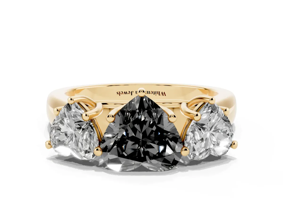 Fancy Black Heart Cut Three-Stone Diamond Ring with Prong Setting on a Classic Band Yellow gold