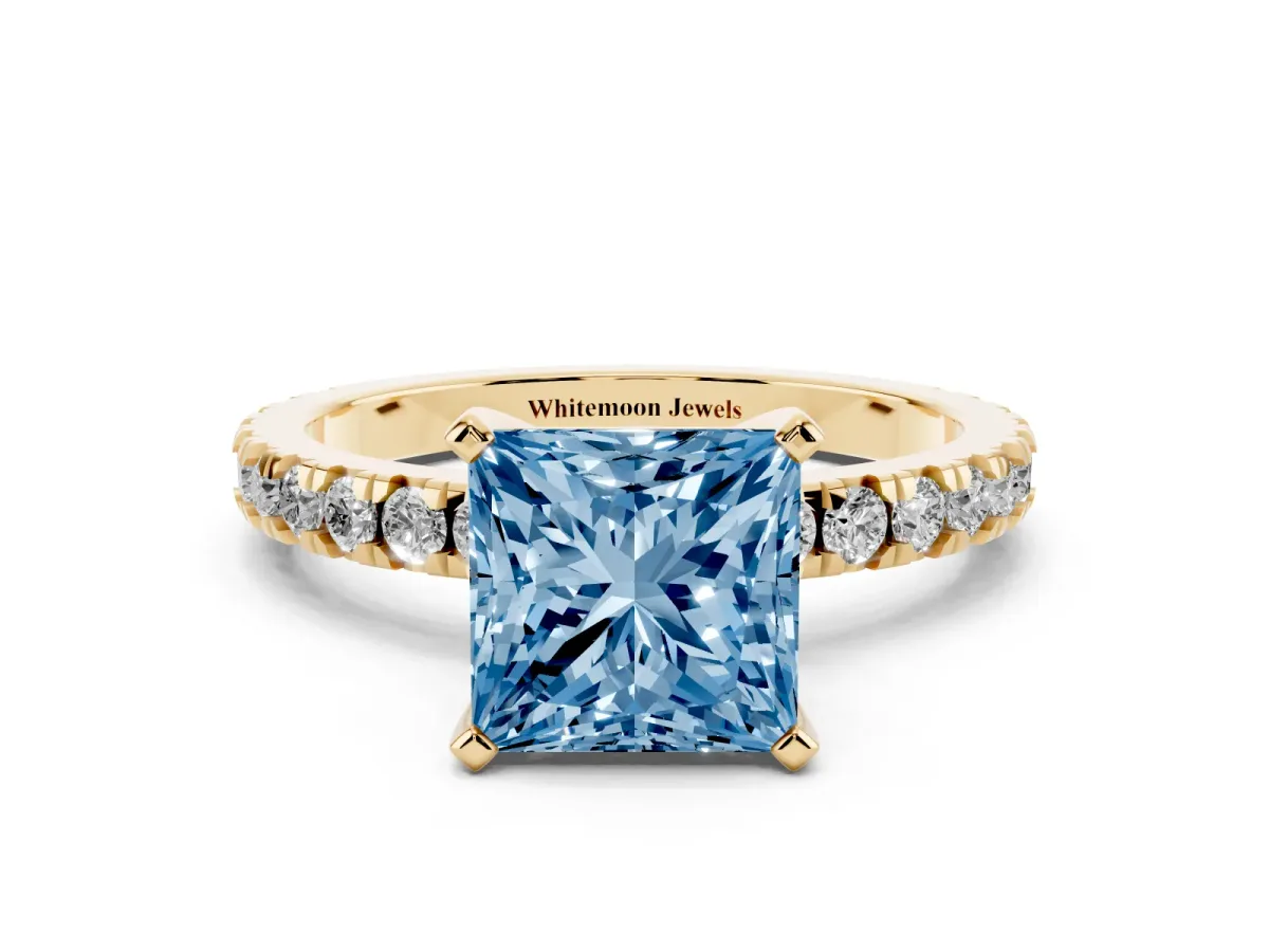 Fancy Blue Princess Cut Diamond Pavé Band Solitaire with Four-Prong Setting Yellow gold