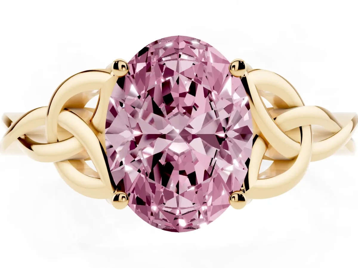 Fancy Pink Oval Cut Diamond Solitaire Engagement Ring with Celtic Knot Band and Four-Prong Setting Yellow gold