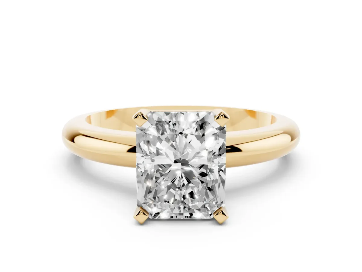 Radiant Cut Diamond Solitaire Engagement Ring with Round Band and Four-Prong Setting Yellow gold