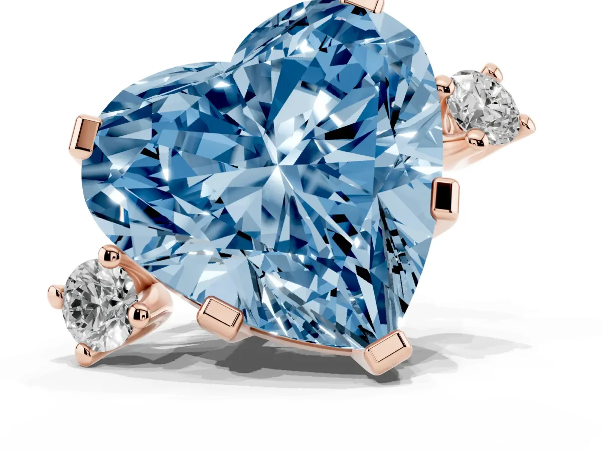 Fancy Blue Heart Cut Cut Three-Stone Solitaire Ring with Round Accent Diamonds and Four-Prong Setting Rose gold