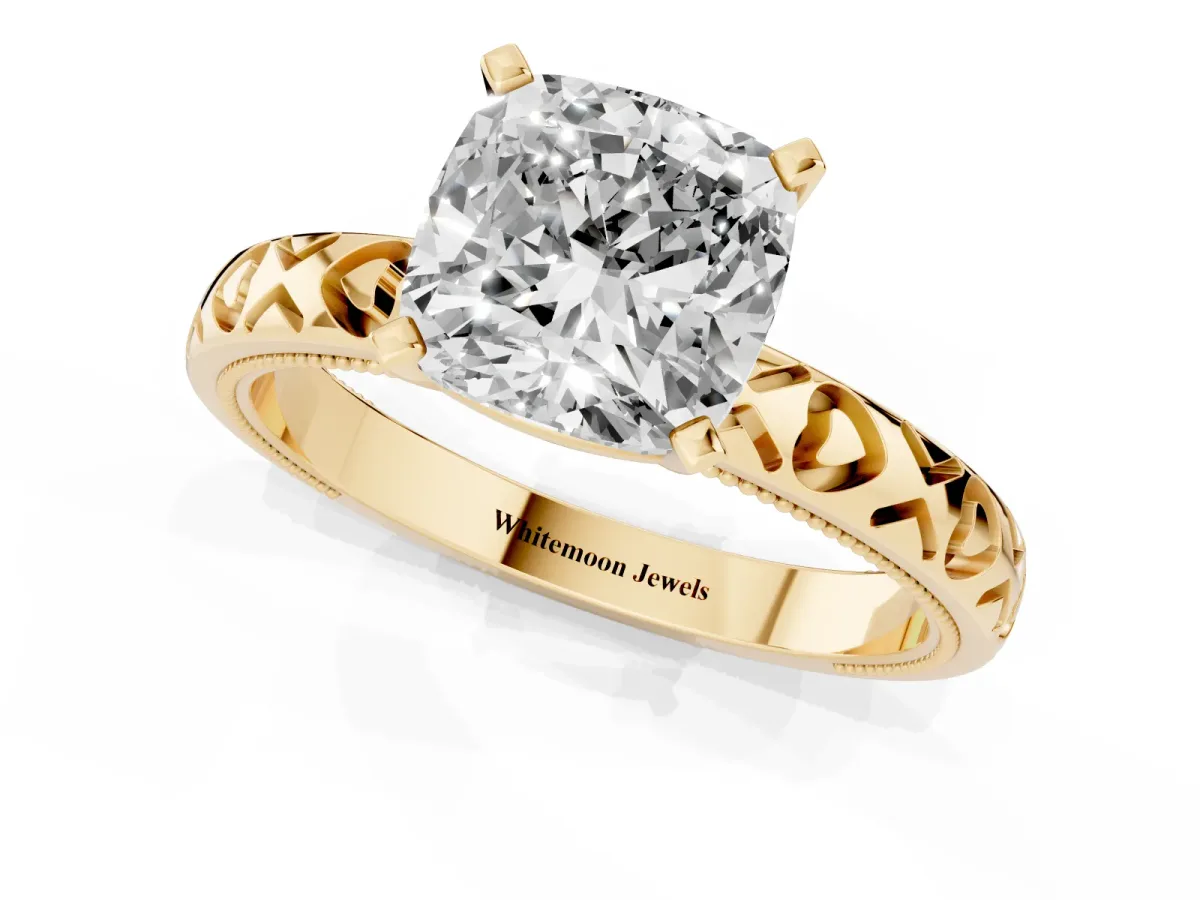 Cushion Cut Solitaire Diamond Engagement Ring with XO Engraved Band and Four-Prong Setting Yellow gold