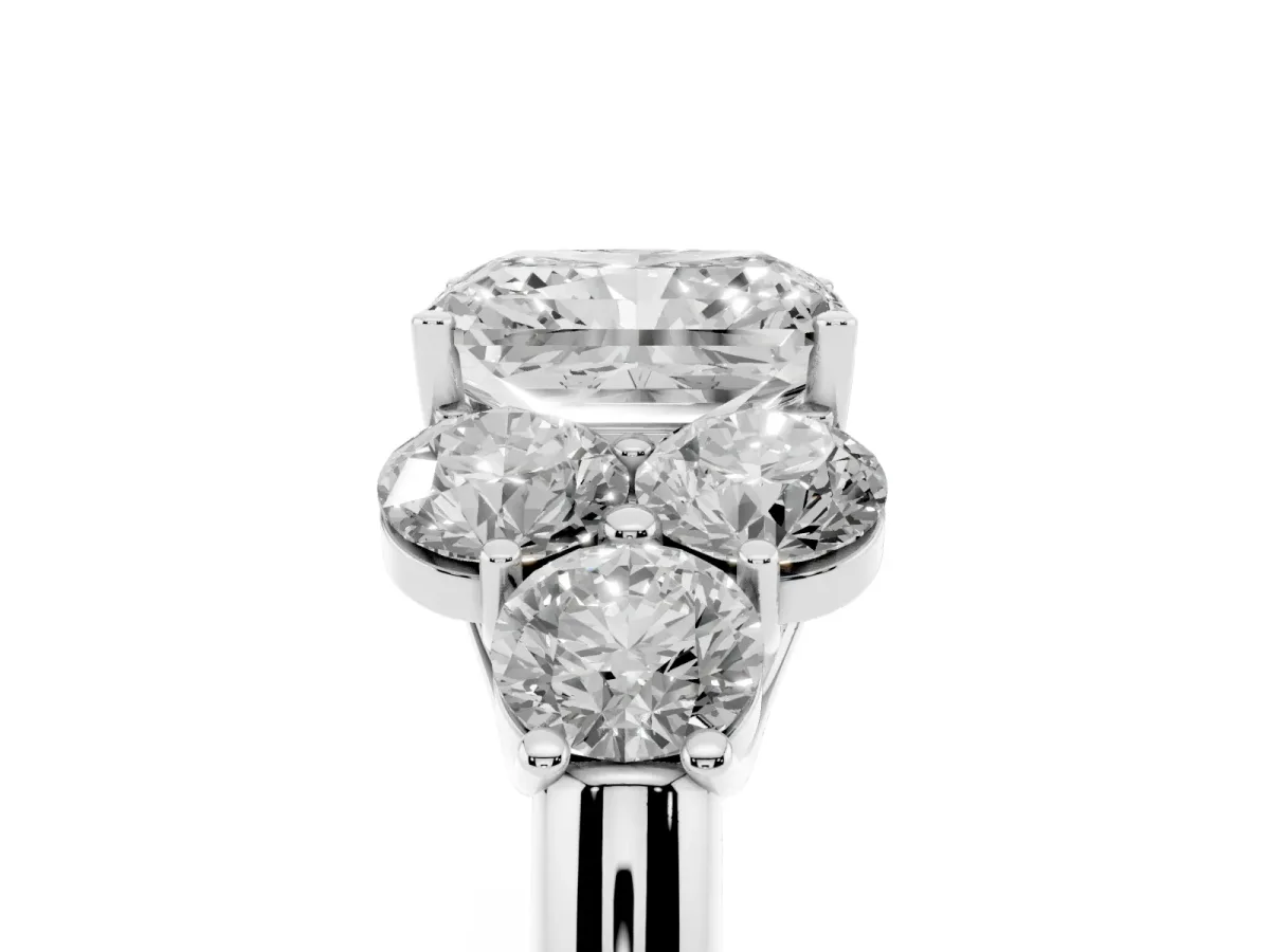 Radiant Cut Cut Diamond Cluster Ring with Round Accent Stones and Prong Setting on a Classic Band White gold