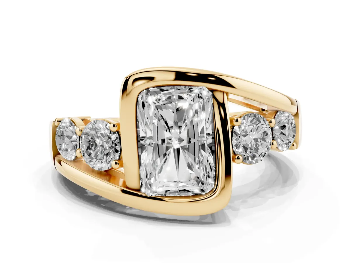 Bezel Set Radiant Cut Diamond Bypass Ring with Round Accents Yellow gold