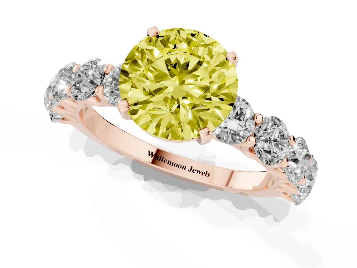 Fancy Yellow Round Cut Diamond Prong Setting with Side Stones on a Pave Band Rose gold