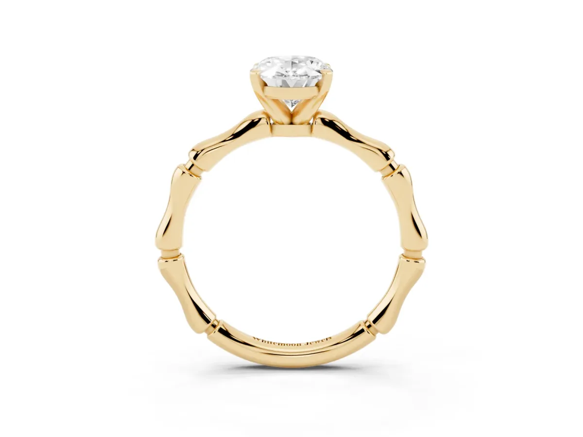 Oval Cut Solitaire Diamond Ring with Bamboo Band and Four-Prong Setting Yellow gold