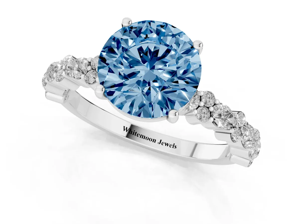 Fancy Blue Round Cut Diamond Side Stone Solitaire Ring with Round and Four-Prong Setting Silver