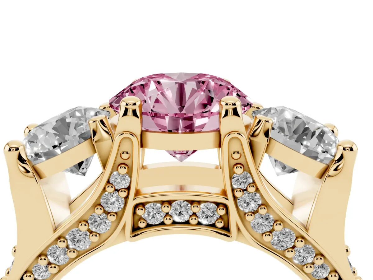 Fancy Pink Round Cut Diamond Three-Stone Ring with Channel Set Band and Four-Prong Setting Yellow gold