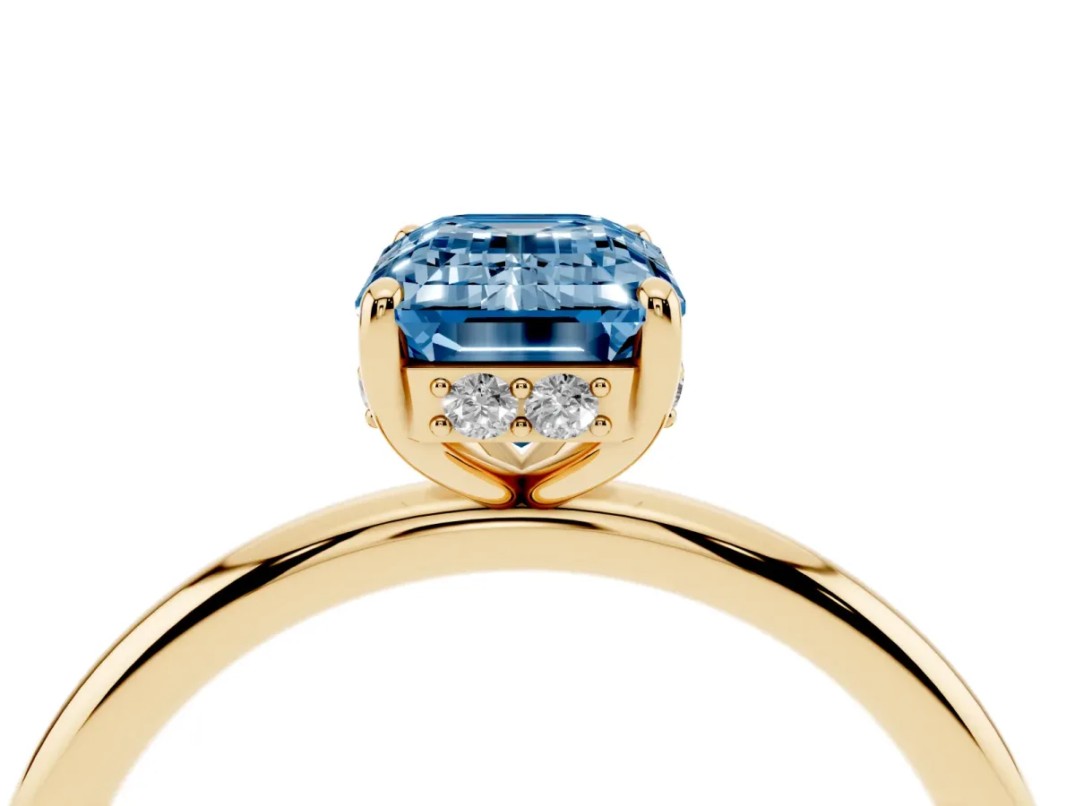Fancy Blue Emerald Cut Solitaire Diamond Ring with a Classic Band and Four-Prong Setting Yellow gold
