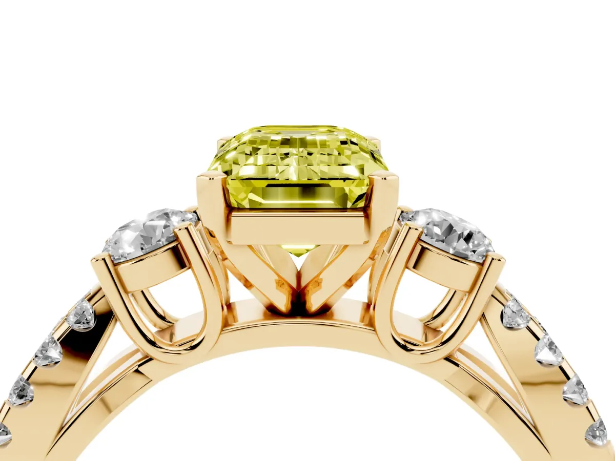 Fancy Yellow Emerald Cut Diamond Three-Stone Ring with Pavé Split Shank and Four-Prong Setting Yellow gold