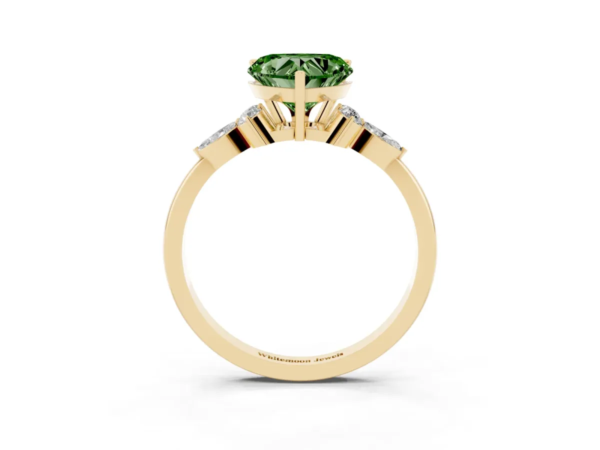 Fancy Green Heart Cut Brilliant Diamond Solitaire Ring with Pear Side Stones and Four-Prong Setting Yellow gold