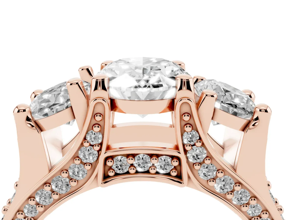 Oval Cut Diamond Three-Stone Ring with Channel Set Band and Four-Prong Setting Rose gold