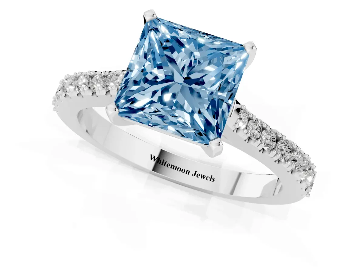 Fancy Blue Princess Cut Cut Solitaire Diamond Engagement Ring with Pave Band and Four-Prong Setting White gold