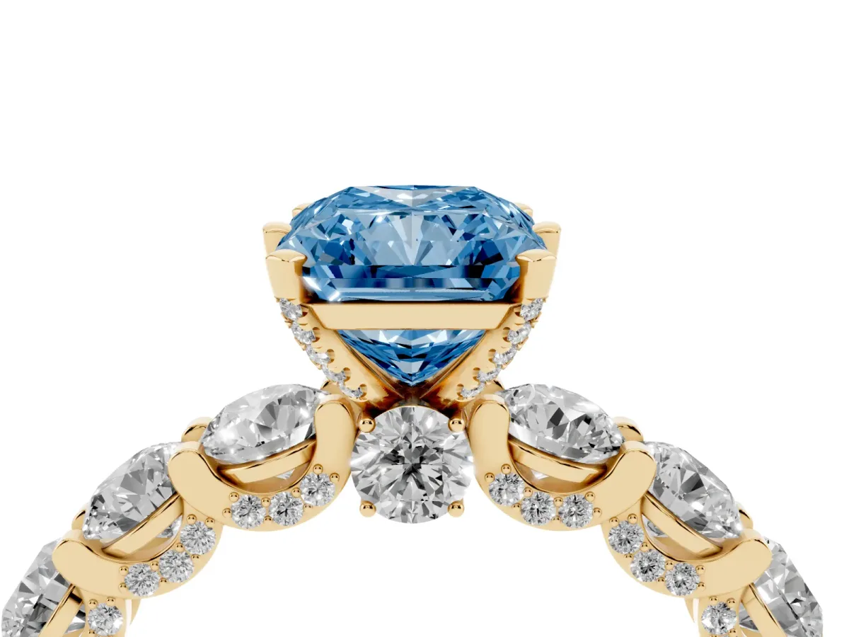 Fancy Blue Radiant Cut Diamond Side Stone Engagement Ring with Four-Prong Setting Yellow gold
