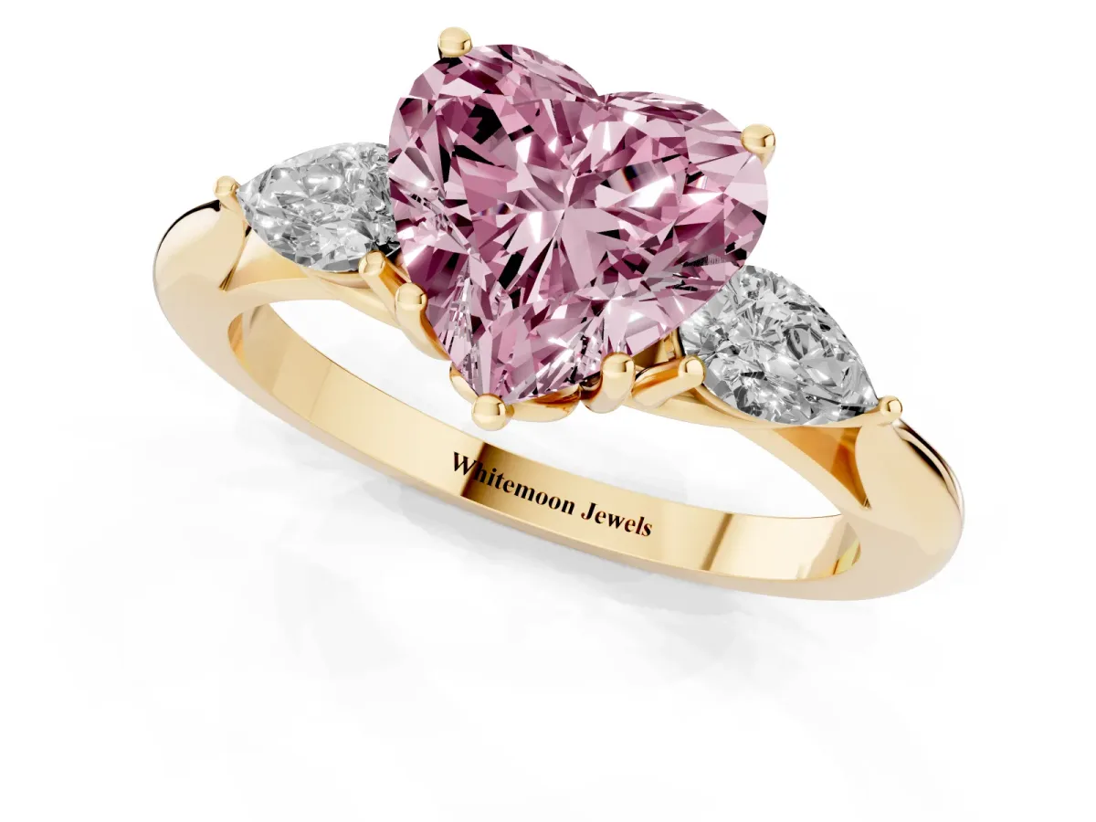 Fancy Pink Heart Cut Diamond Three-Stone Ring with Pear Side Stones and Prong Setting Yellow gold