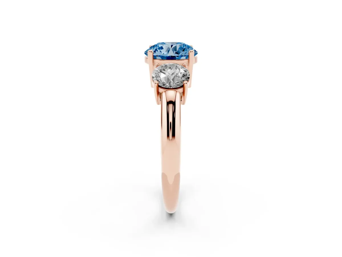 Fancy Blue Three-Stone Round Cut Cut Diamond Engagement Ring with Prong Setting on a White Gold Band Rose gold