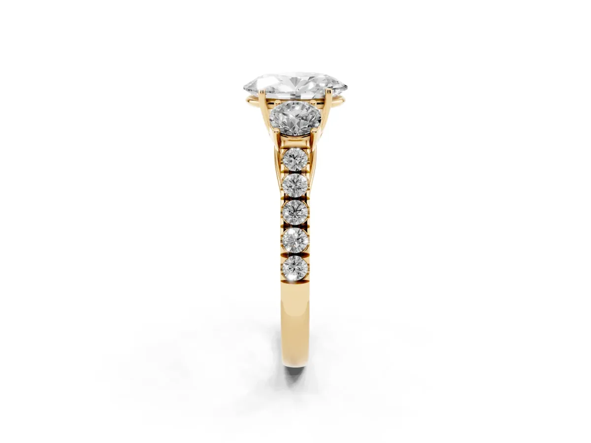 Oval Cut Cut Diamond Three-Stone Ring with Round Side Stones and Pavé Band Yellow gold