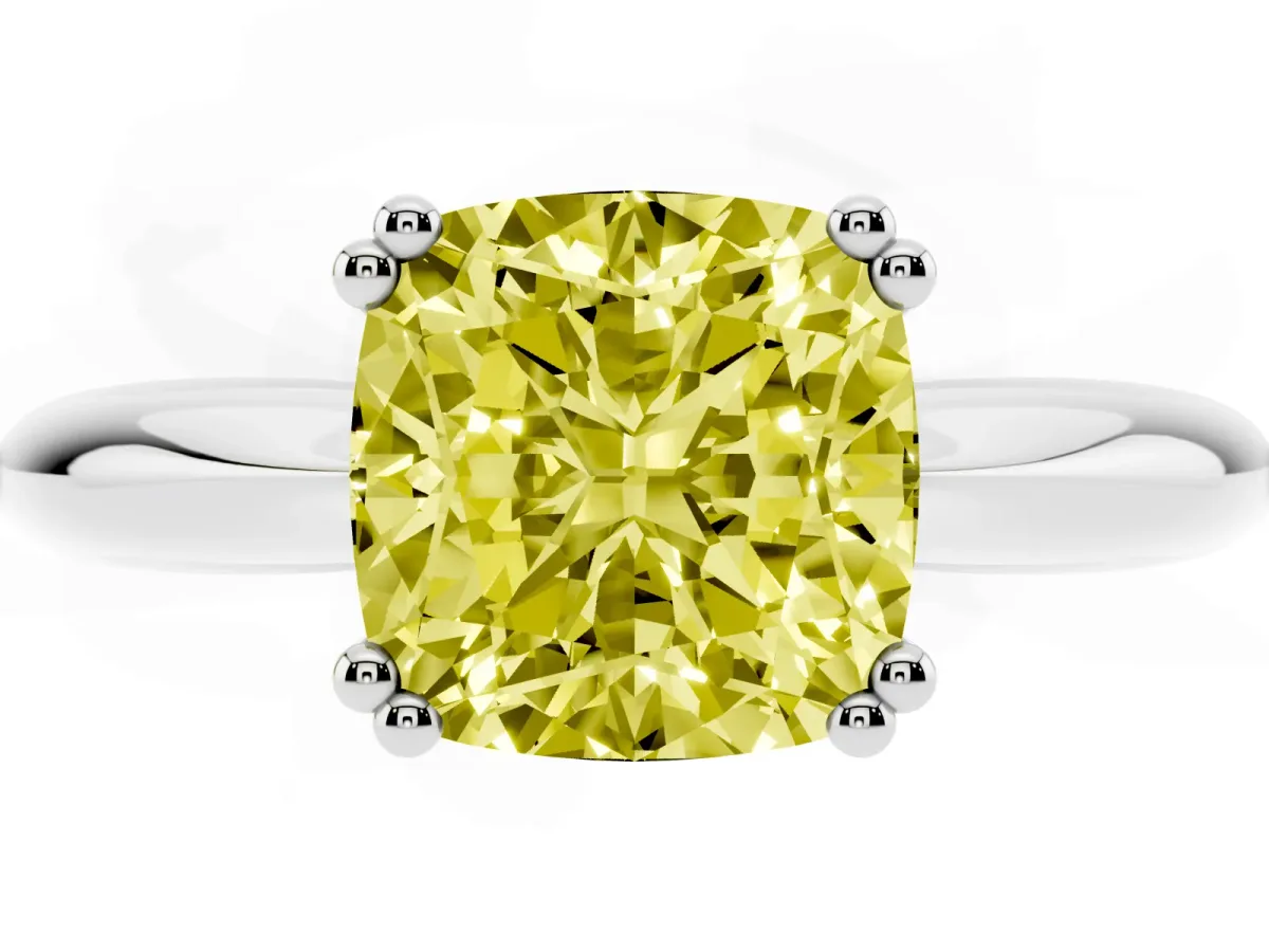 Fancy Yellow Cushion Cut Cut Solitaire Engagement Ring with Tapered Band and Four-Prong Setting Platinum