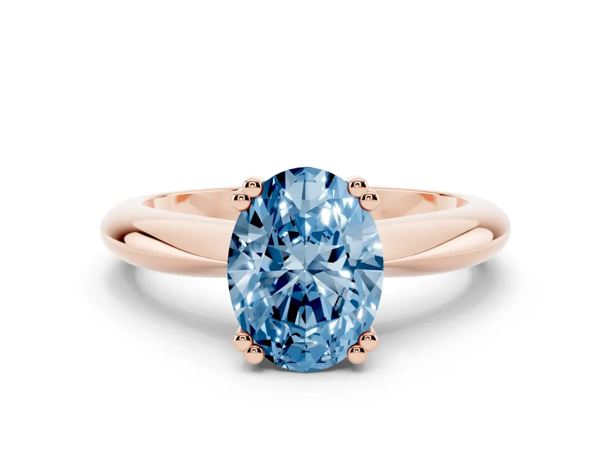 Fancy Blue Oval Cut Cut Solitaire Engagement Ring with Tapered Band and Four-Prong Setting Rose gold