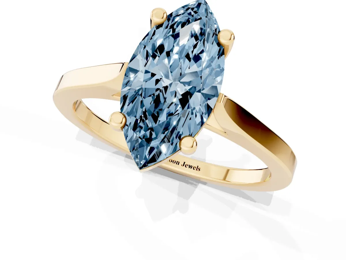 Fancy Blue Marquise Cut Solitaire Diamond Ring with Four-Prong Setting and Tapered Band Yellow gold
